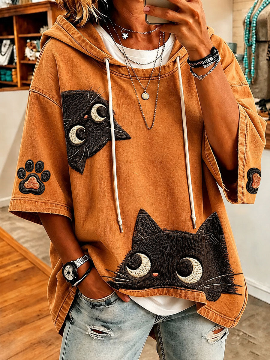 Ioana oversized hoodie by Bennett & Lowe featuring playful cat-print design, soft fabric, and relaxed fit in a cozy style.