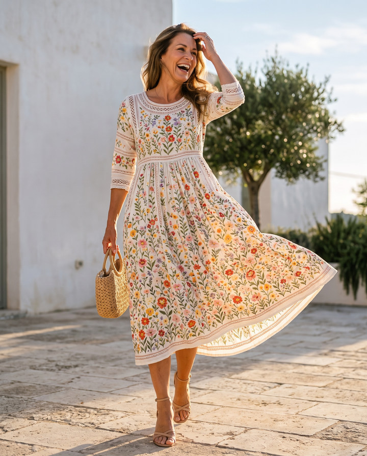 Bennett and Lowe Wildflower Meadow Charm Midi Dress with floral print and flowing fabric, displayed on a hanger.