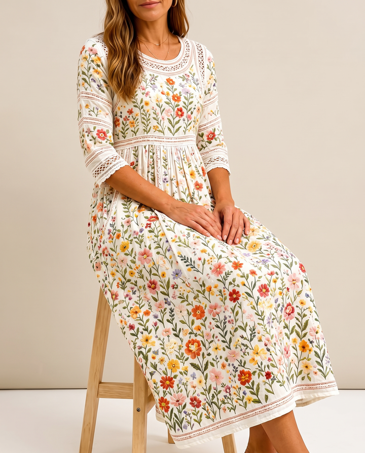 Bennett and Lowe Wildflower Meadow Charm Midi Dress with floral print, fitted bodice, and flowing skirt on a mannequin.