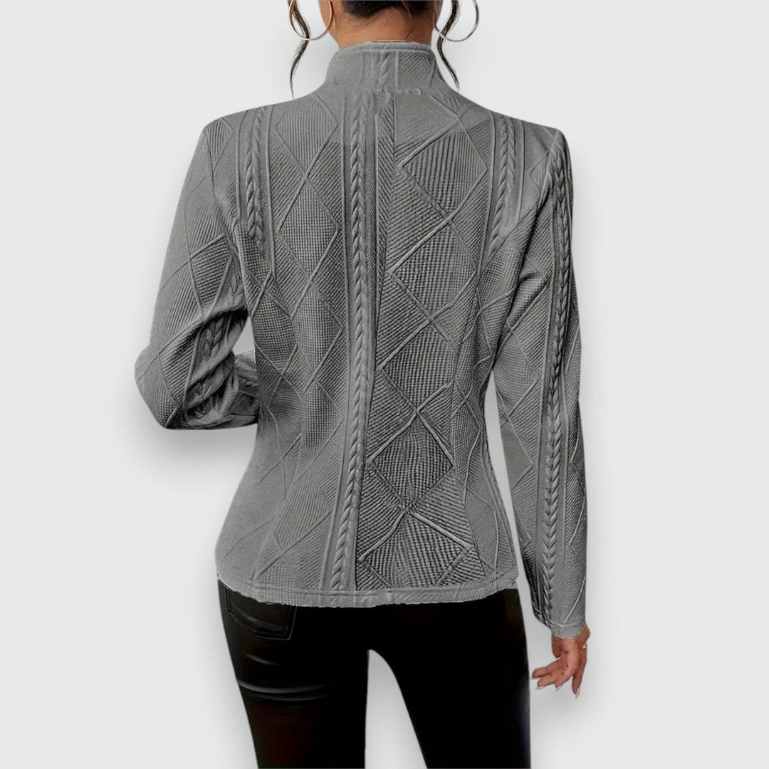 Women's textured Bennett and Lowe Loretta cardigan with button-front, cable-knit pattern, long sleeves, and mock-neck design.