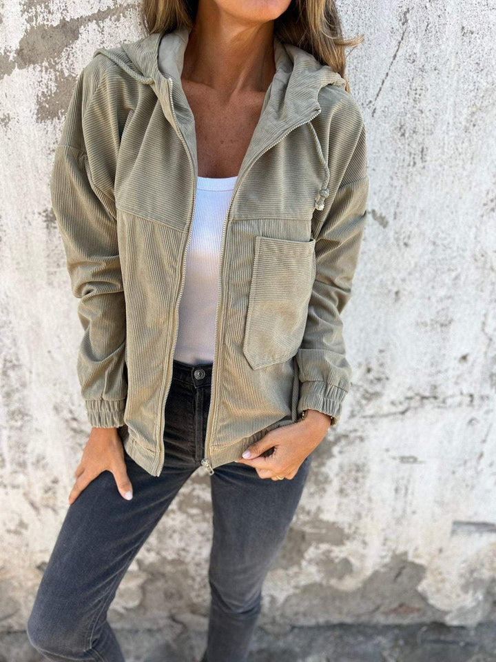 Women’s ribbed zip-up hooded jacket by Bennett and Lowe, oversized fit, quilted corduroy design with front zipper and hood.