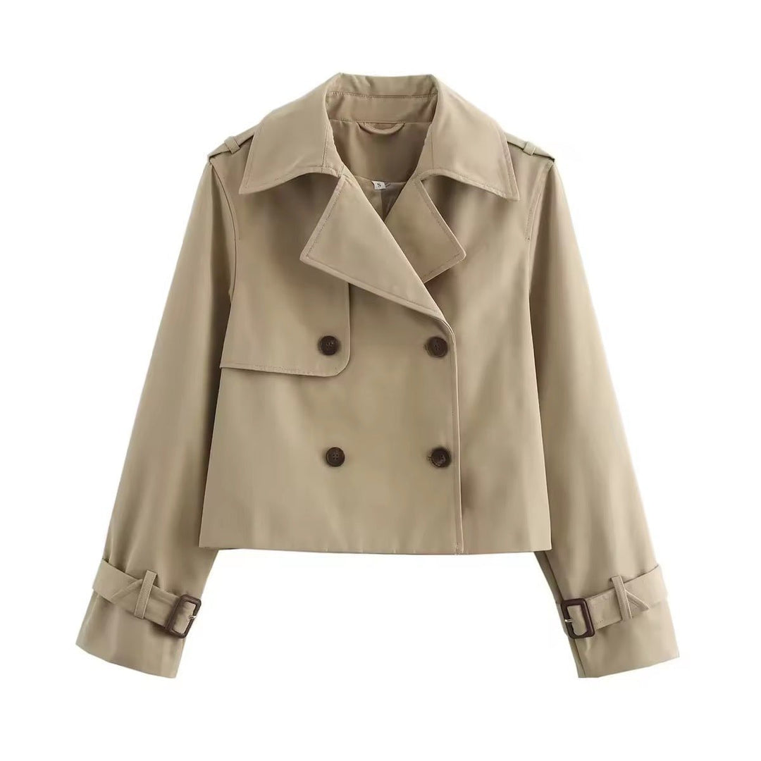 Eugenia cropped double-breasted trench coat for women by Bennett and Lowe with buckle cuffs, shown in a stylish outdoor setting.