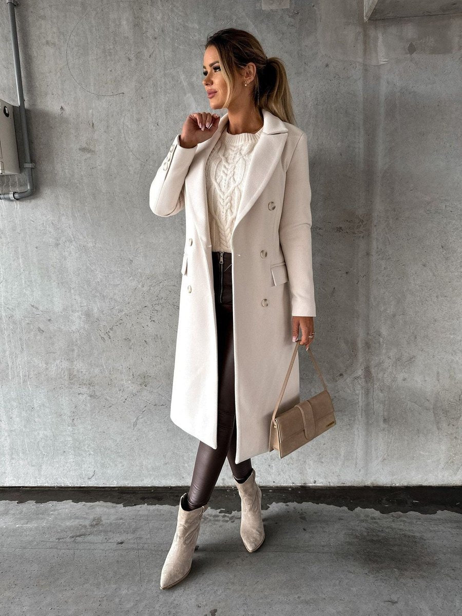 Women’s double-breasted longline overcoat by Bennett and Lowe, featuring long sleeves and a tailored midi-length design.