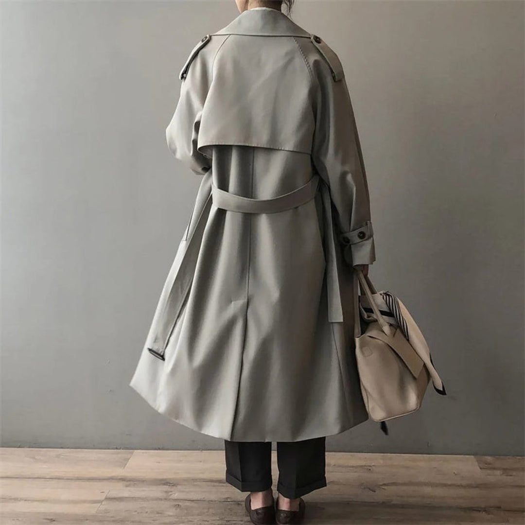 Women’s double-breasted water-repellent long trench coat by Bennett and Lowe, featuring a belt and classic design.