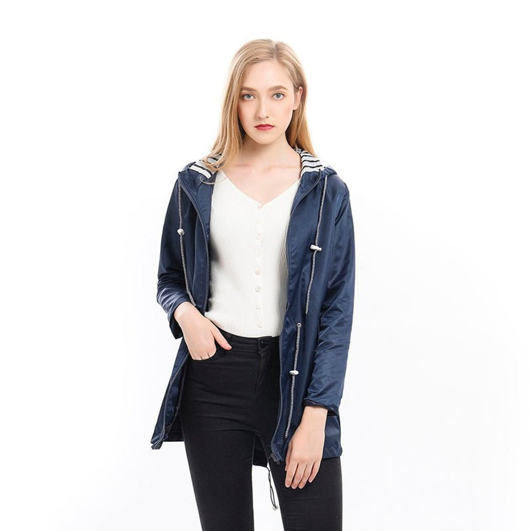 Women’s waterproof hooded raincoat with drawstring waist from Bennett and Lowe, designed for protection in wet weather.