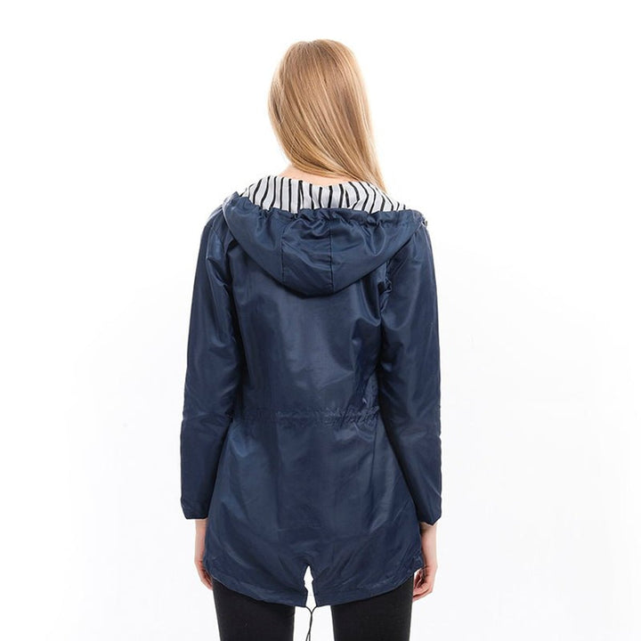 Women’s waterproof hooded raincoat with drawstrings by Bennett and Lowe, featuring a stylish design and practical rain protection.