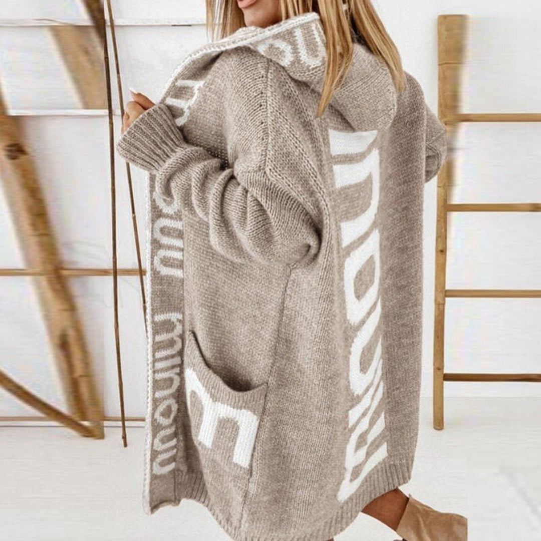 Women’s hooded open-front knit cardigan by Bennett and Lowe, featuring a cozy, relaxed fit with a draped collar and long sleeves.