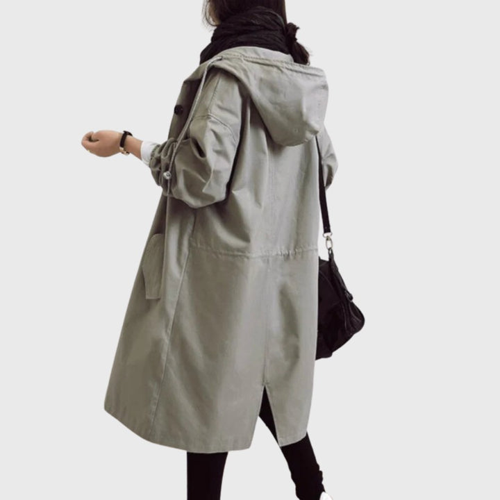 Women’s waterproof hooded long trench coat by Bennett and Lowe, relaxed fit with a stylish and functional design.