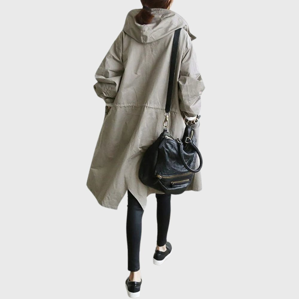 Women’s waterproof hooded long trench coat by Bennett and Lowe, relaxed fit, stylish and functional for rainy weather.