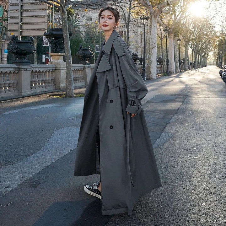 Bennett and Lowe Lena oversized double-breasted long trench coat for women, beige, with wide lapels and belted waist.