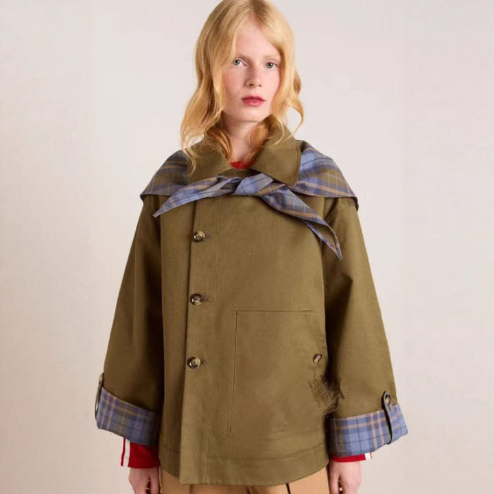 Women’s oversized plaid-lined double-breasted utility coat by Bennett and Lowe featuring a trench style and classic design.