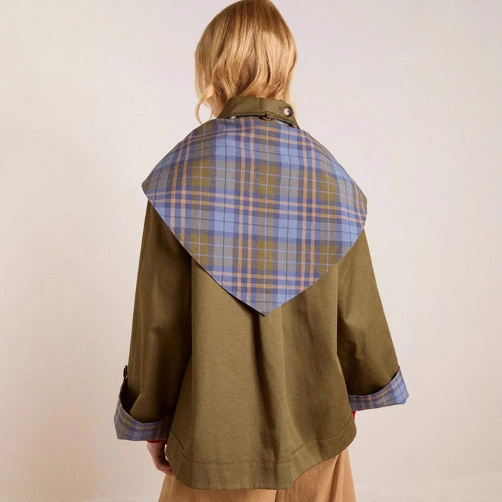 Women’s oversized double-breasted plaid-lined utility coat by Bennett and Lowe, featuring a classic trench design and large lapels.