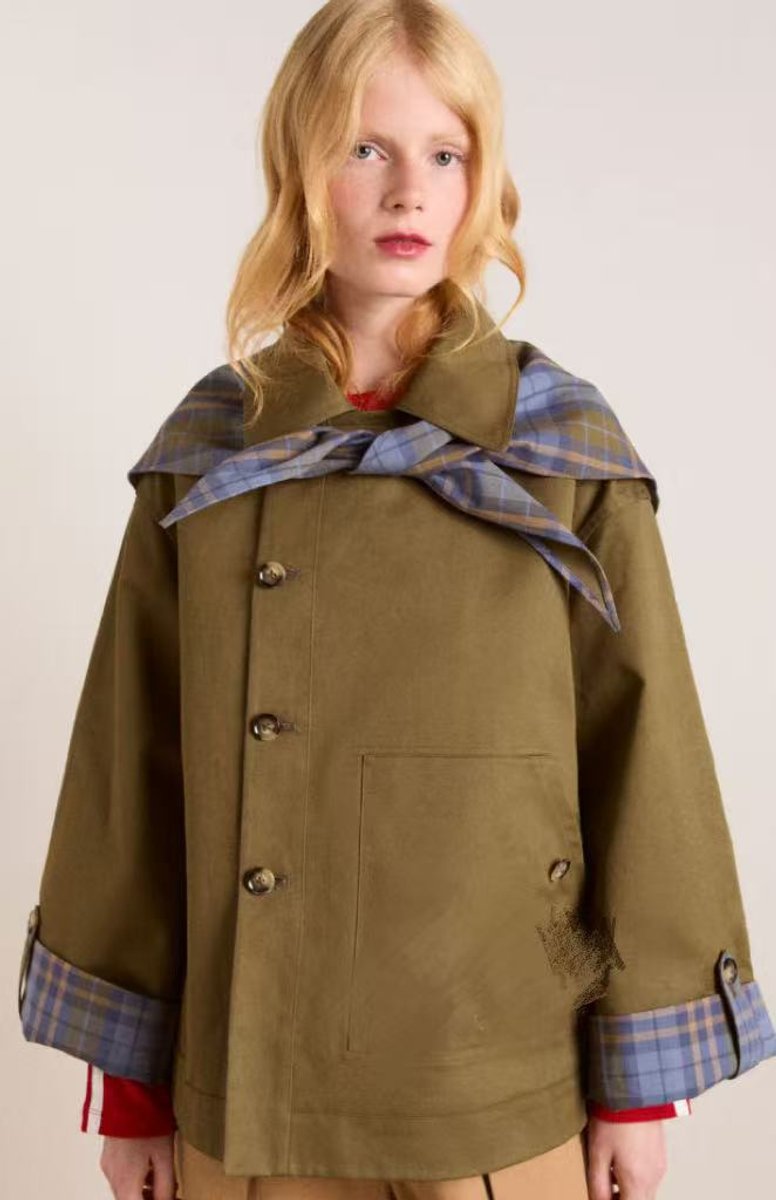 Women’s oversized Bennett and Lowe utility coat with double-breasted design, plaid lining, and trench coat style.