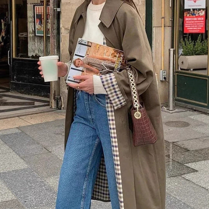 Women’s oversized plaid-lined long trench coat by Bennett and Lowe, with a refined, elegant design and classic trench silhouette.