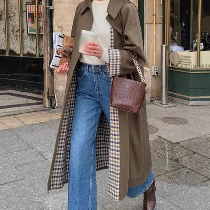Women's oversized plaid-lined long trench coat by Bennett and Lowe, featuring a refined, stylish design and classic trench silhouette.