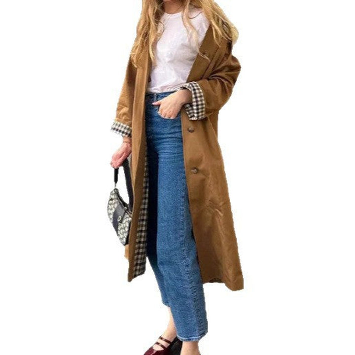 Women’s oversized plaid-lined long trench coat by Bennett and Lowe, featuring a refined, stylish design and classic trench silhouette.