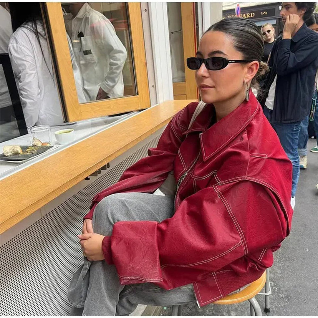 Women's oversized quilted bomber jacket with contrast stitching from Bennett and Lowe, featuring a stylish, relaxed fit and ribbed cuffs.
