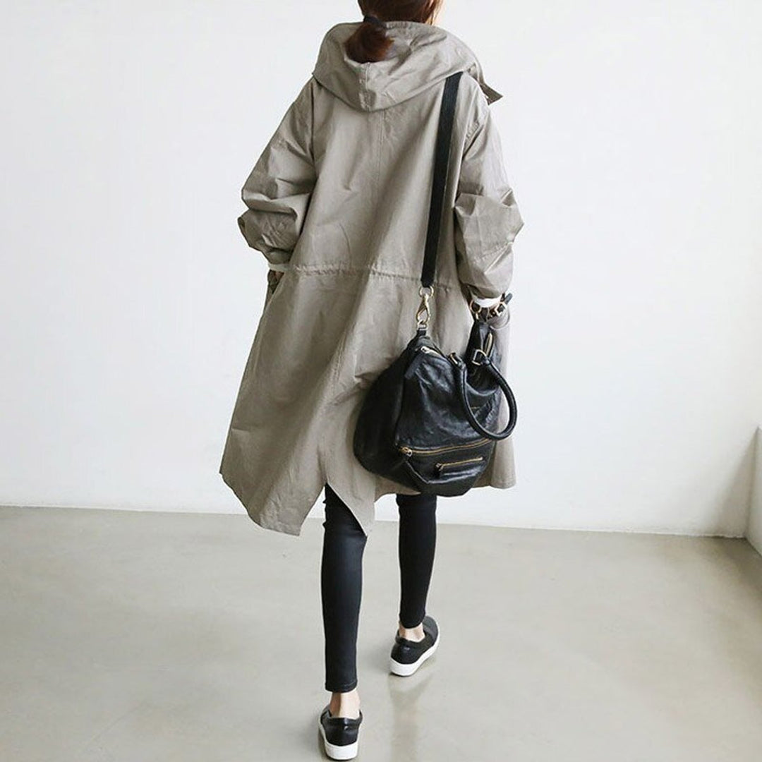 Women’s oversized Bennett and Lowe water-resistant hooded button-front coat, featuring a relaxed fit and classic trench design.