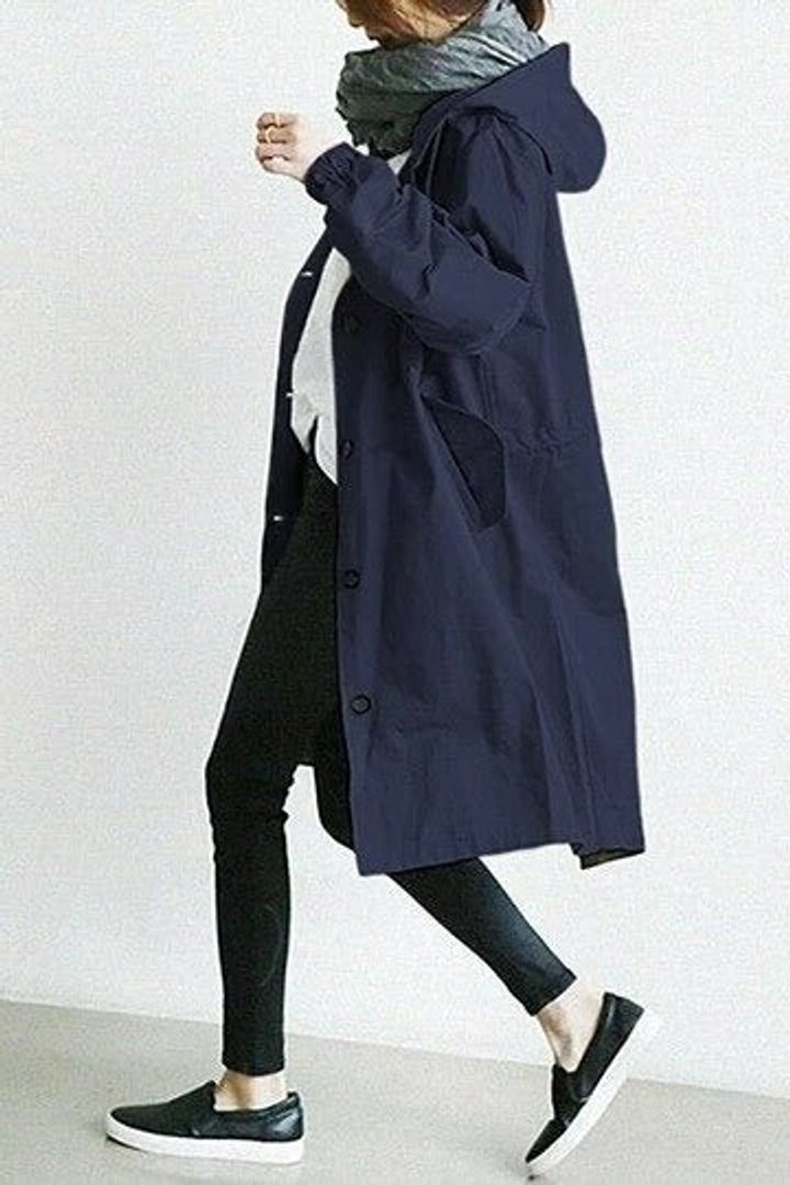 Women’s oversized water-resistant hooded coat by Bennett and Lowe with button-front design and trench style.