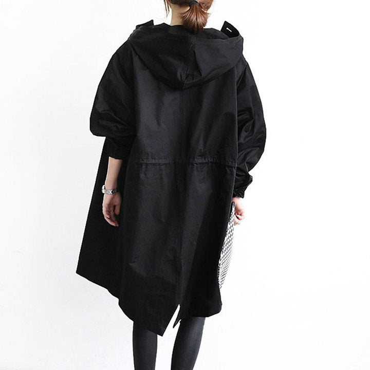 Women's oversized Bennett and Lowe water-resistant hooded button-front coat, showing its trench style and large front buttons.
