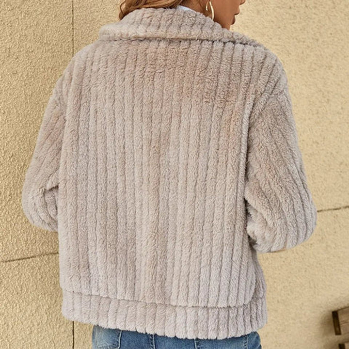 Women's quilted fleece zip-up jacket by Bennett and Lowe with plush, fluffy interior and cozy design for warmth.
