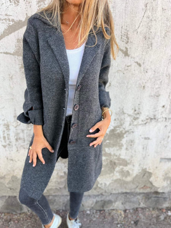 Relaxed-fit women's long lapel coat by Bennett and Lowe, featuring a button front and tailored silhouette.